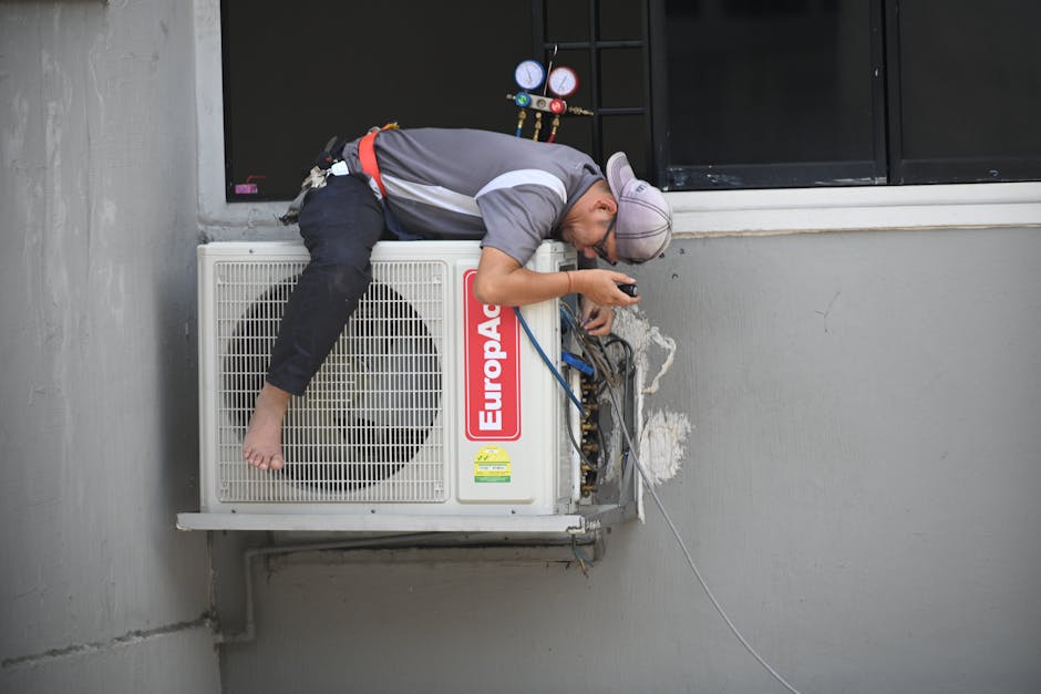 Friendly HVAC technician assessing equipment